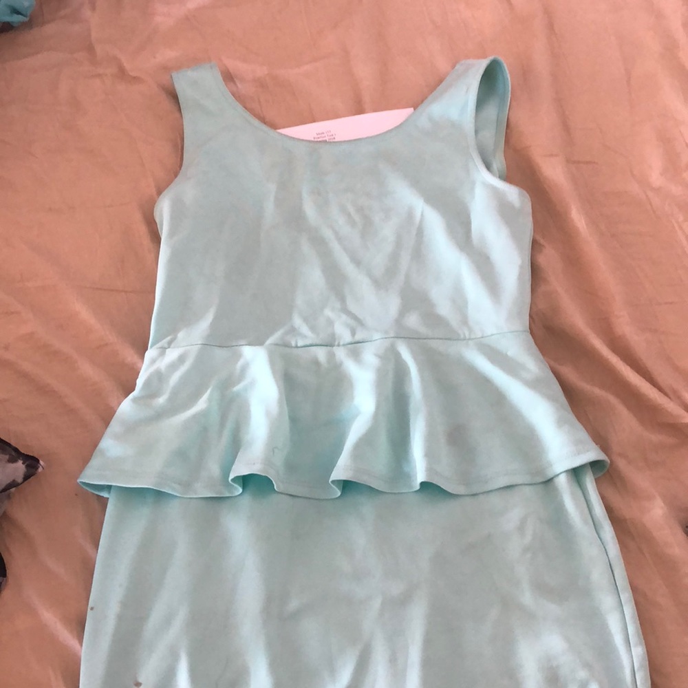 Peplum dress with bow and split on the back.